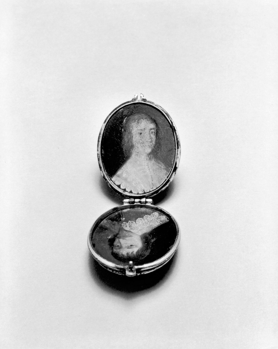 A seventeenth-century French locket, open, with a small painted portrait inside